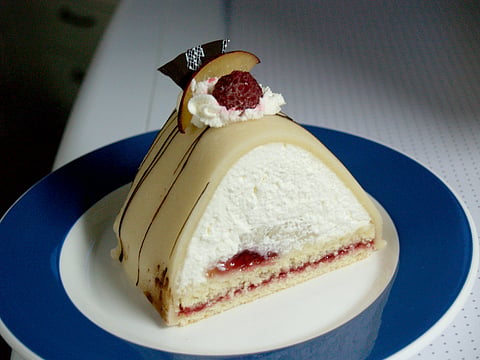 Gåsebryst is a decadent dessert filled with vanilla cream and raspberry jam