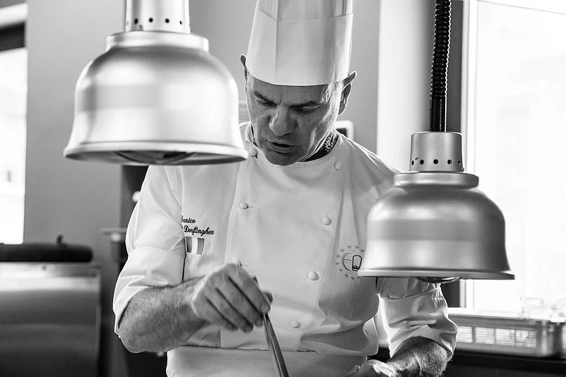 A portrait of Chef Enrico Delfingher