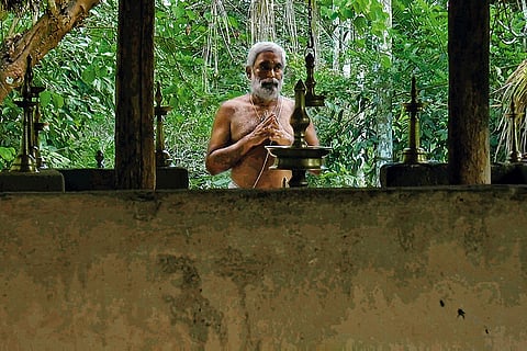 A devotee praying at the Valmiki Ashram