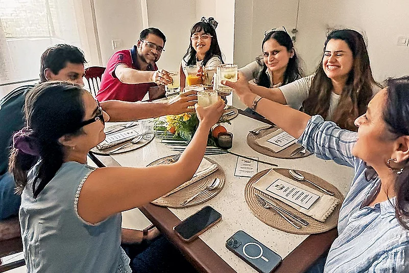 Guests share a meal at one of The LOST Table dinner parties