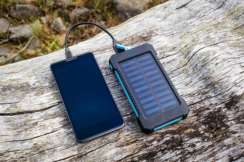 A phone being charged by a solar battery