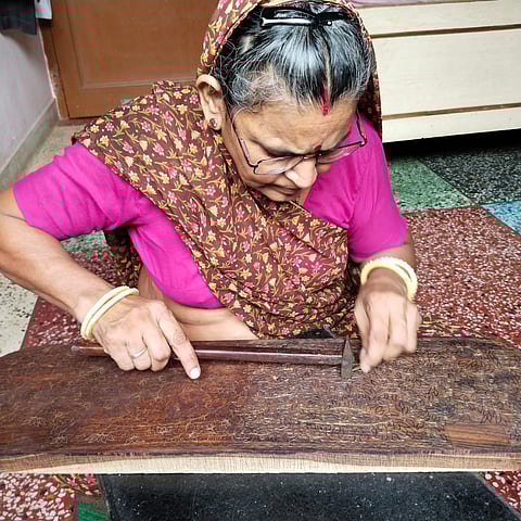 Kamlesh Sharma while working on a wall panel. 