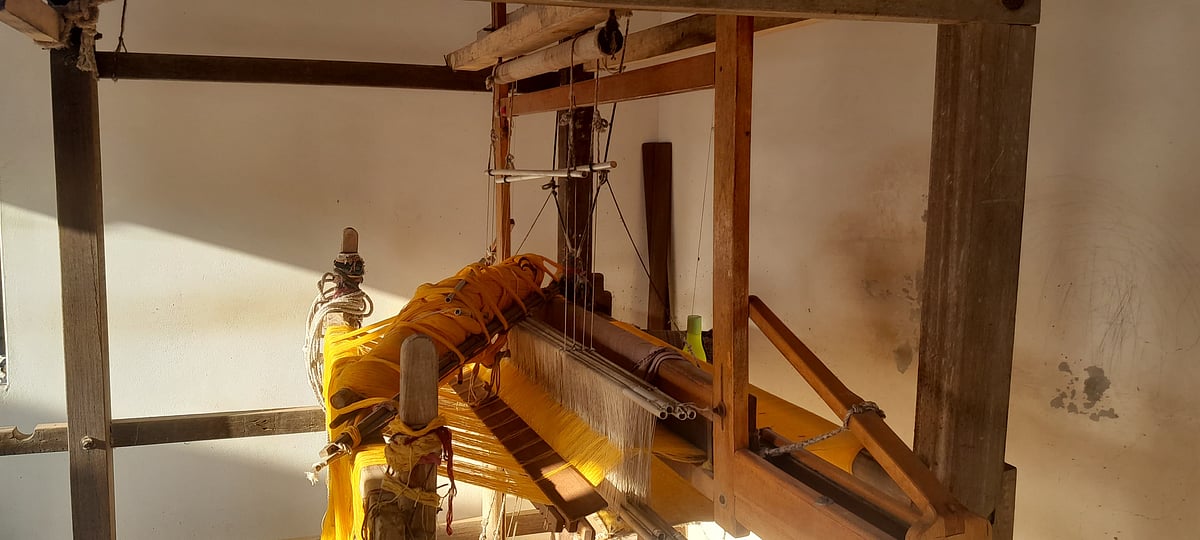 Machines draped in thread at a workshop in Bhujodi.