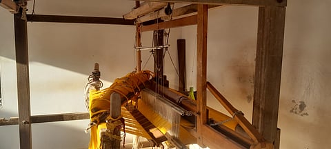 Machines draped in thread at a workshop in Bhujodi.
