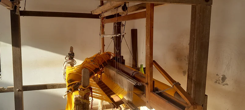 Machines draped in thread at a workshop in Bhujodi.