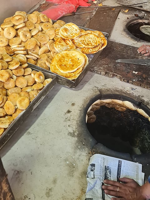 Freshly-baked biscuit-like kulcha made in a tandoor.