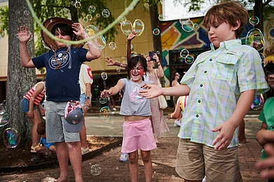 festivalinternational/Facebook : Children enjoy bubbles at the 2024 Festival International de Louisiane in Lafayette