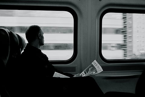 Consider carrying a book while travelling in a train. 