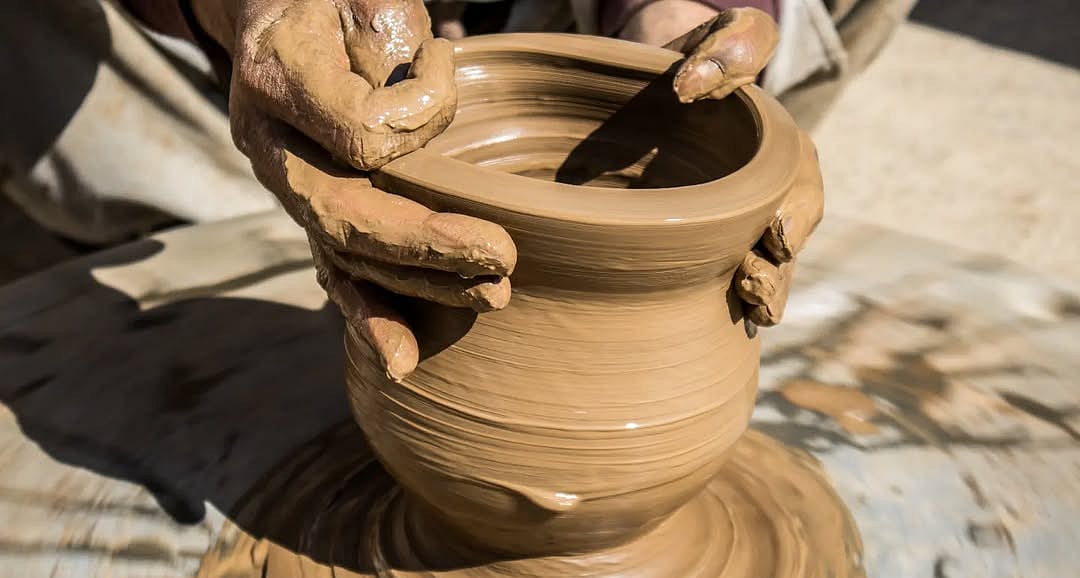 A potter at work in the Gufkral caves.