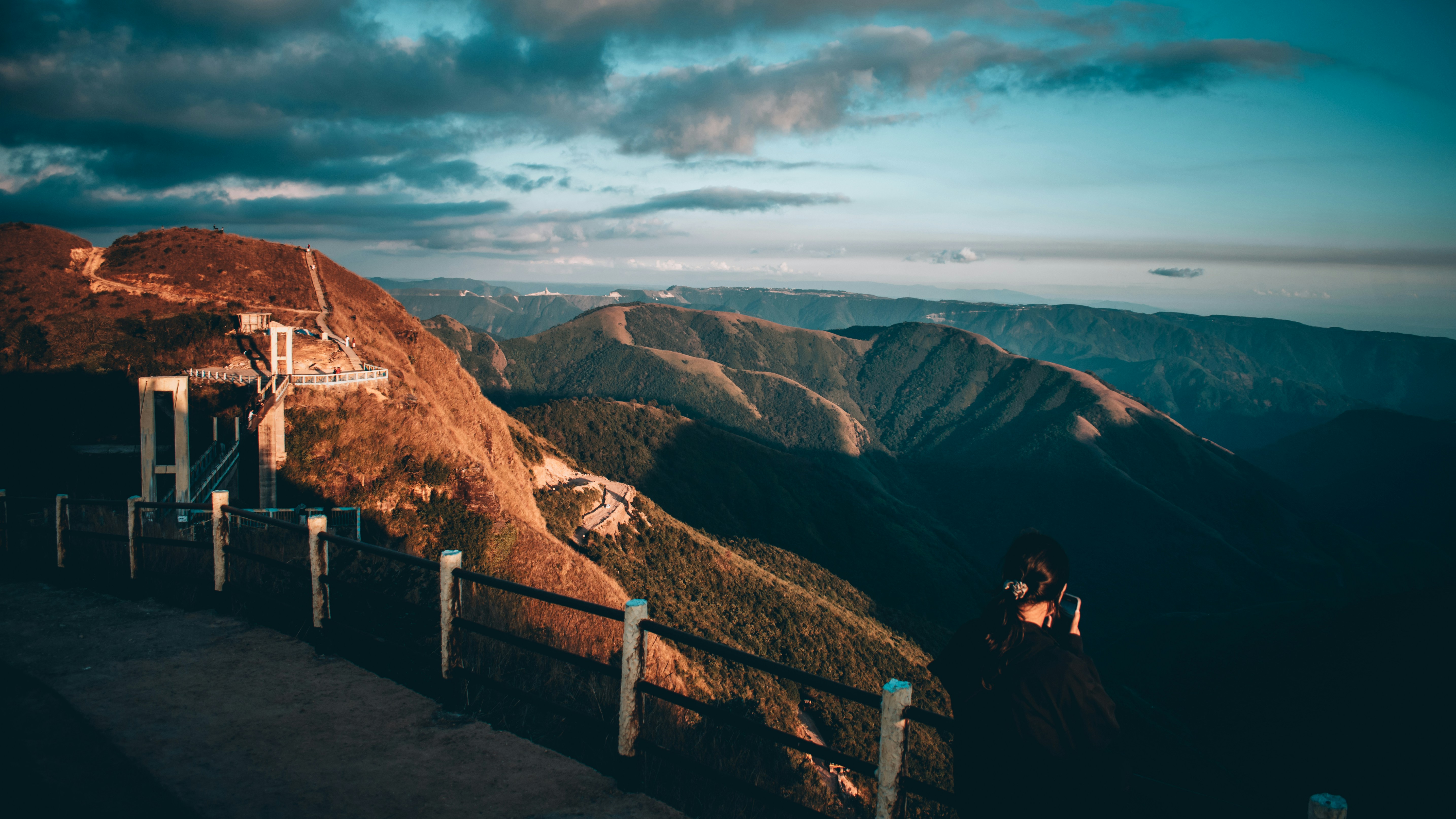 A view of rolling hills in Sohra, Meghalaya - blissed_shots/Unsplash