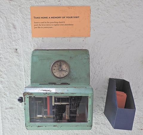 A vintage punching clock that was used to punch in the timings of entry and exit of the employees.