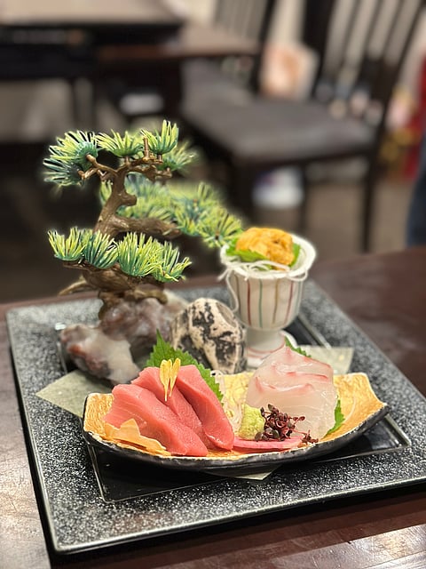 When in Ginza, try local delicacies like Sashimi.