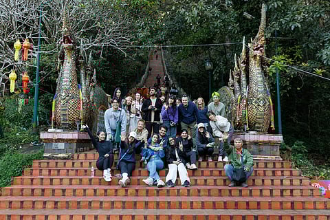 At the iconic staris of Wat Phra That Doi Suthep
