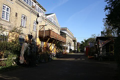 The distinctive architecture, often marked by bright colours and unconventional designs, adds to the area’s charm