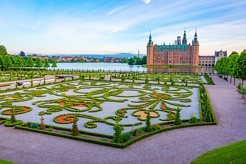 The baroque-style gardens that surround the Frederiksborg Castle in Denmark. 