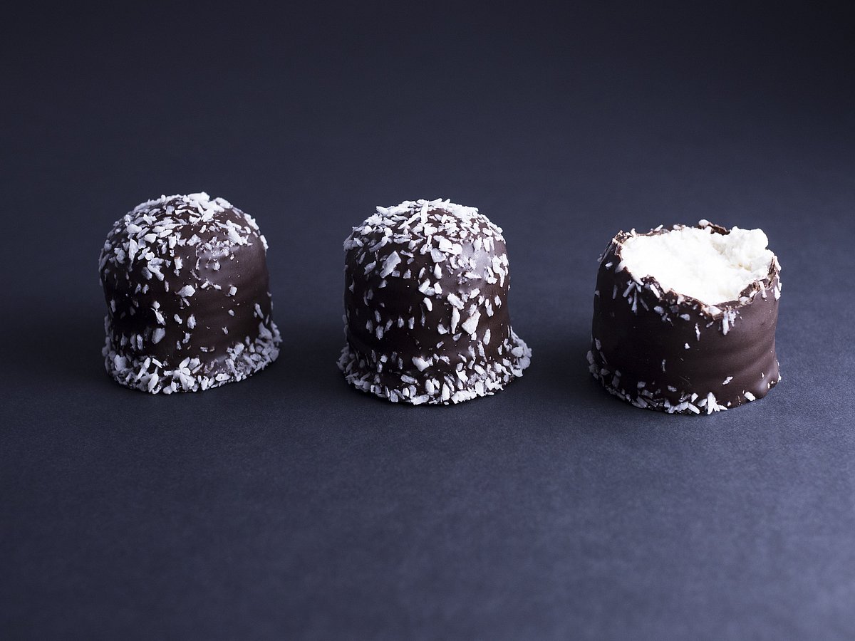 Flødeboller are chocolate-coated marshmallow treats that are eaten during festive occasions in Denmark.