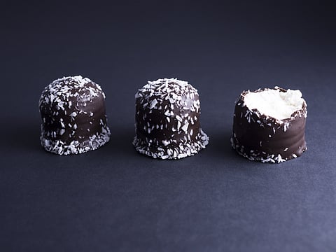 Flødeboller are chocolate-coated marshmallow treats that are eaten during festive occasions in Denmark.