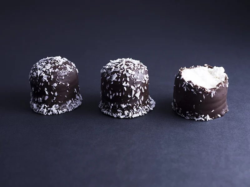 Flødeboller are chocolate-coated marshmallow treats that are eaten during festive occasions in Denmark.