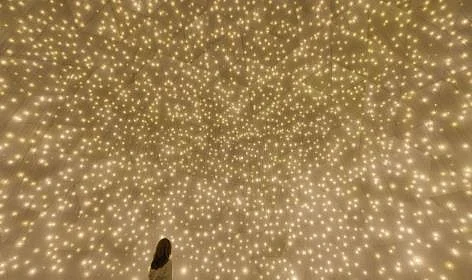 In Massless Suns and Dark Suns, spheres of light and darkness converge to challenge perceptions of reality.