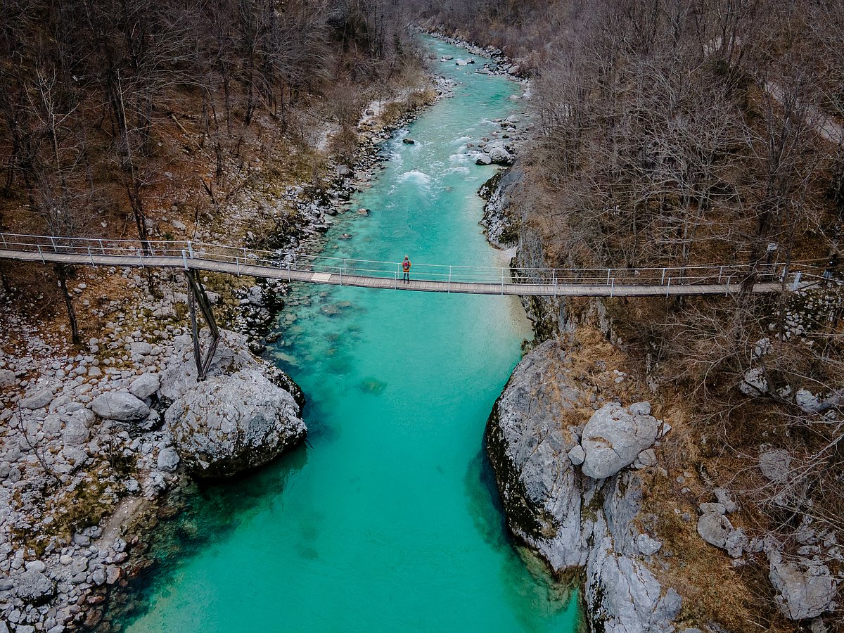 The hanging bridge over the Soča river catching the glimpse of the turquoise river.  