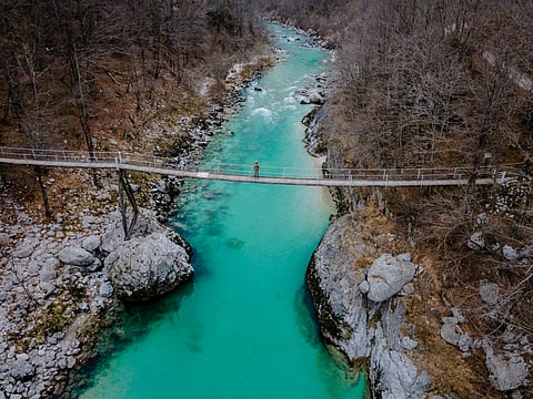 The hanging bridge over the Soča river catching the glimpse of the turquoise river.
