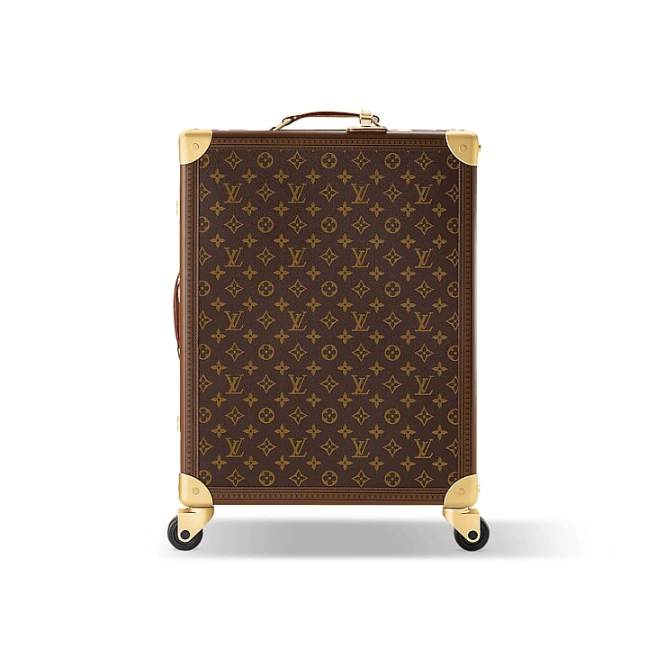 The Louis Vuitton Rolling Trunk luggage in canvas and leather has reinforced corners, wooden slats and rivets