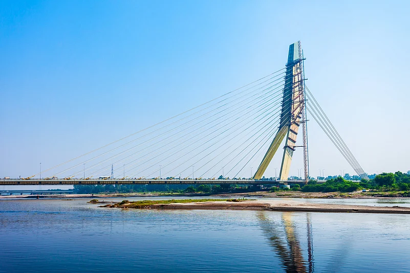 The Signature Bridge spans the Yamuna River and connects Wazirabad to East Delhi