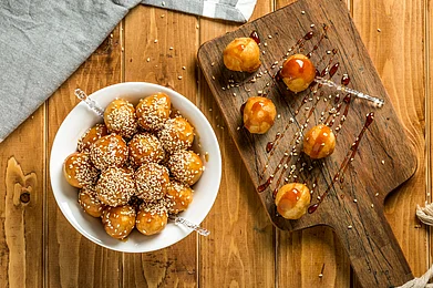shutterstock : Luqaimat are fried, dough fritters that are crunchy on the outside while soft and airy on the inside
