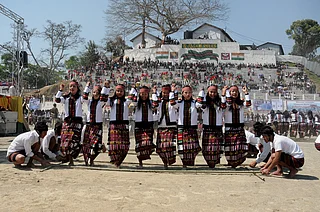Prem Singh Kanwar/Wikimedia Commons : The artists performing a dance ‘Cheraw Kanpui’ during the inauguration of the Chapchar Kut