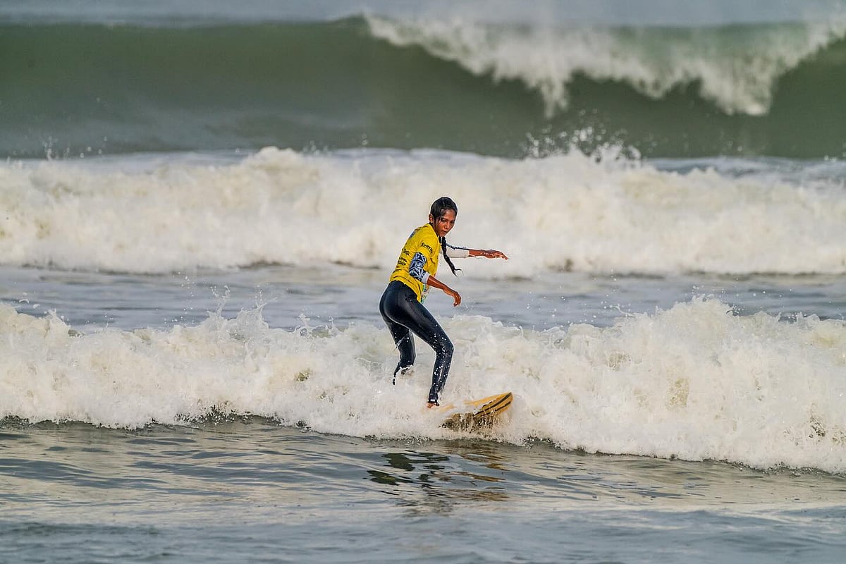 A surfer at Sasihithlu Beach in Mangaluru