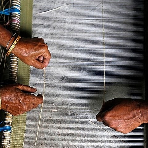 Hands at work on a mat