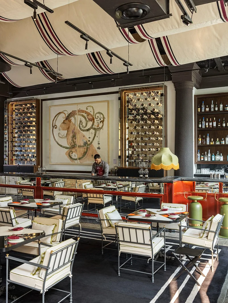 The muted, contemporary accents complement the displayed artworks