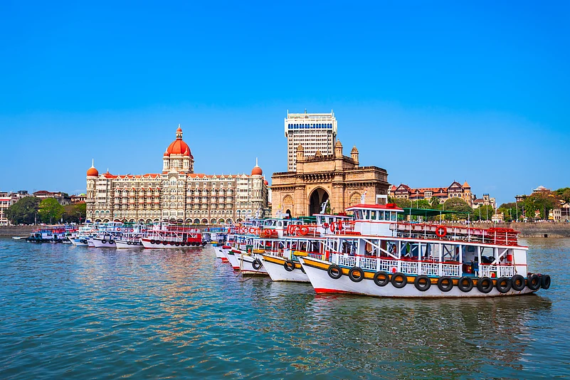 Boats in front of the Gateway of India and the Taj Mahal Palace in Mumbai