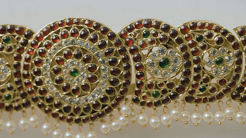 Traditional temple jewellery is made with gold and coloured gemstones