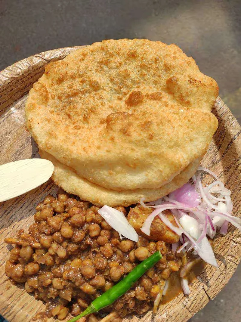Savour a plateful of Delhis famous chole bhature at Chache Di Hatti.