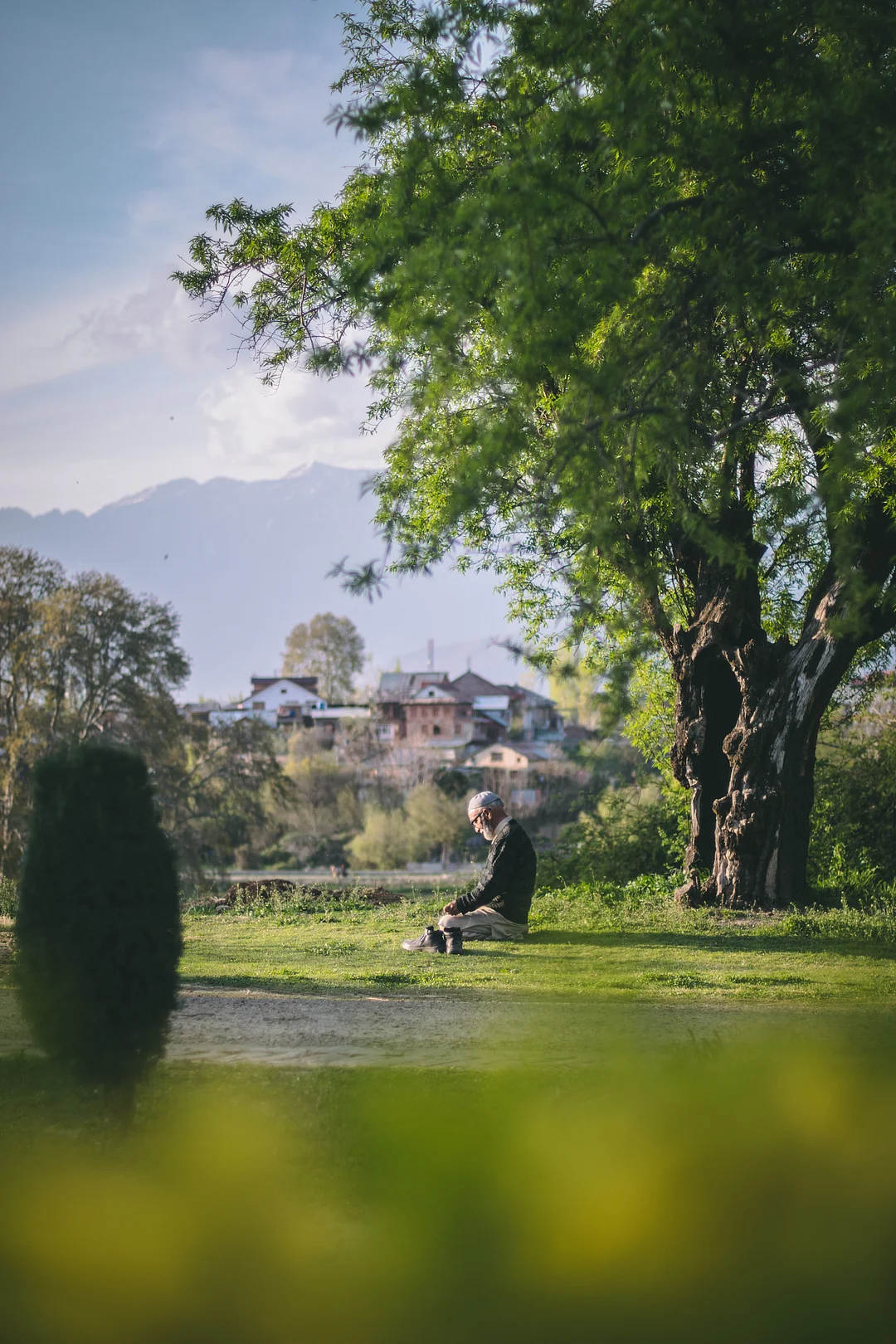A man prays at the Badamwari Garden