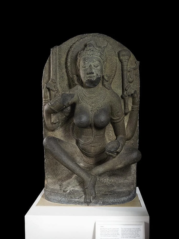 Figure of a mother goddess carrying a skull topped staff and skull cup, now in the British Museum