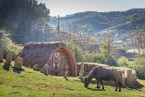The Toda tribe has a temple with a thatched roof and carved entrance