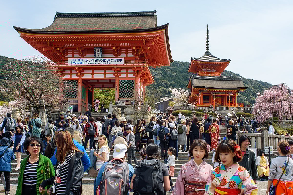 Tourists visit the Kiyomizu-dera, a Buddhist temple located in eastern Kyōto that is a UNESCO World Heritage Site