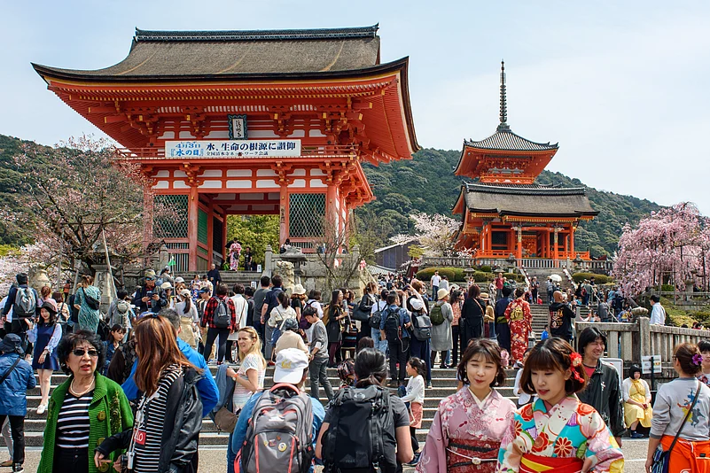 Tourists visit the Kiyomizu-dera, a Buddhist temple located in eastern Kyōto that is a UNESCO World Heritage Site