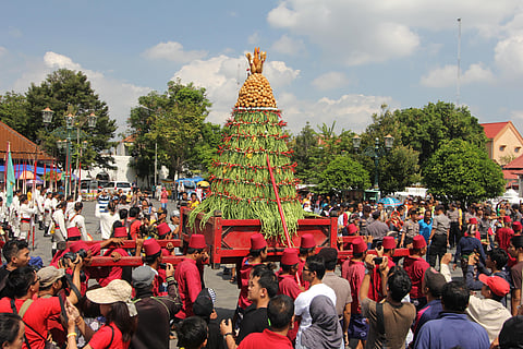The highlight of Grebeg Syawal is a large procession where a giant cone-shaped offering, often made of rice, is paraded through the streets