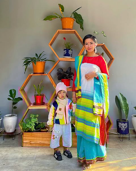 Chef with her nephew in traditional Dimasa dress