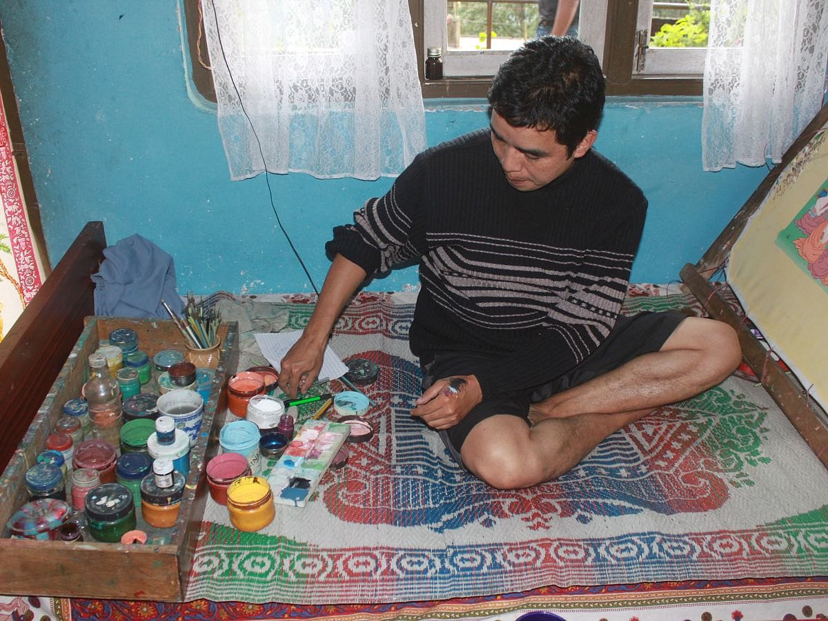 Lakpa at work in his rooftop studio. 