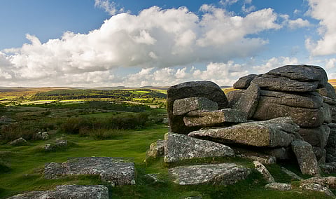 The tors of Dartmoor are enormous granite mounds that rise above the surrounding terrain