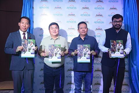 Arunachal Pradesh tourism minister Pasang Dorjee Sona (in a blue shirt) at the launch of the state's new tourism policy along with other dignataries