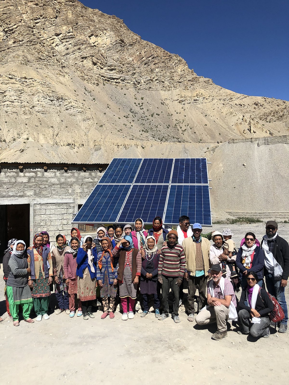 Installation of a solar water pump in a village reduces the daily walk to river beds to collect water