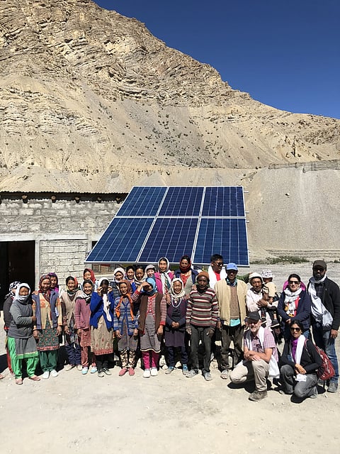 Installation of a solar water pump in a village reduces the daily walk to river beds to collect water