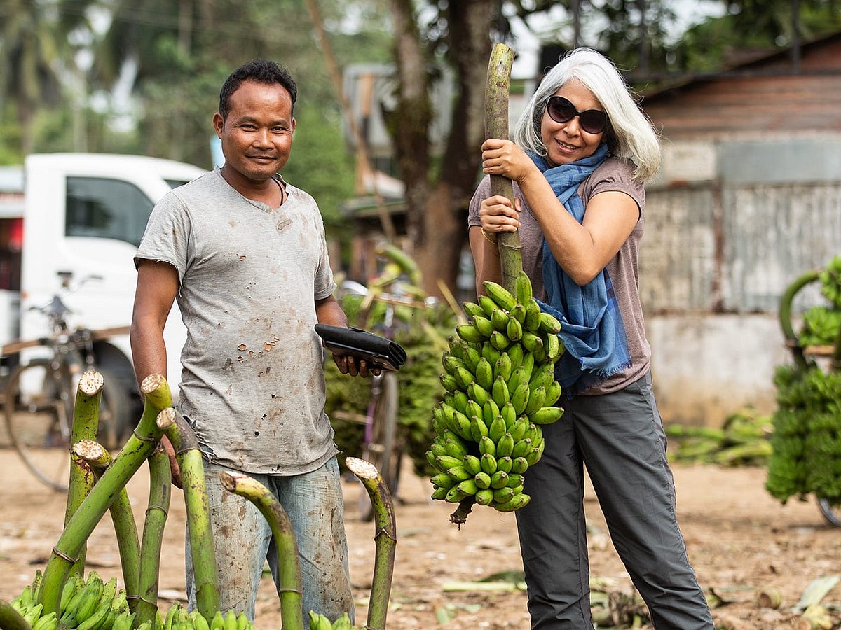 Julie Kagti : Julie Kagti (right) at Darangiri, Asias largest banana market. She is the founder and curator of Curtain Call Adventures