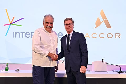 Rahul Bhatia (left), Group Managing Director, InterGlobe Enterprises, shakes hands with Sébastien Bazin (right), the Chairman and CEO of Accor
