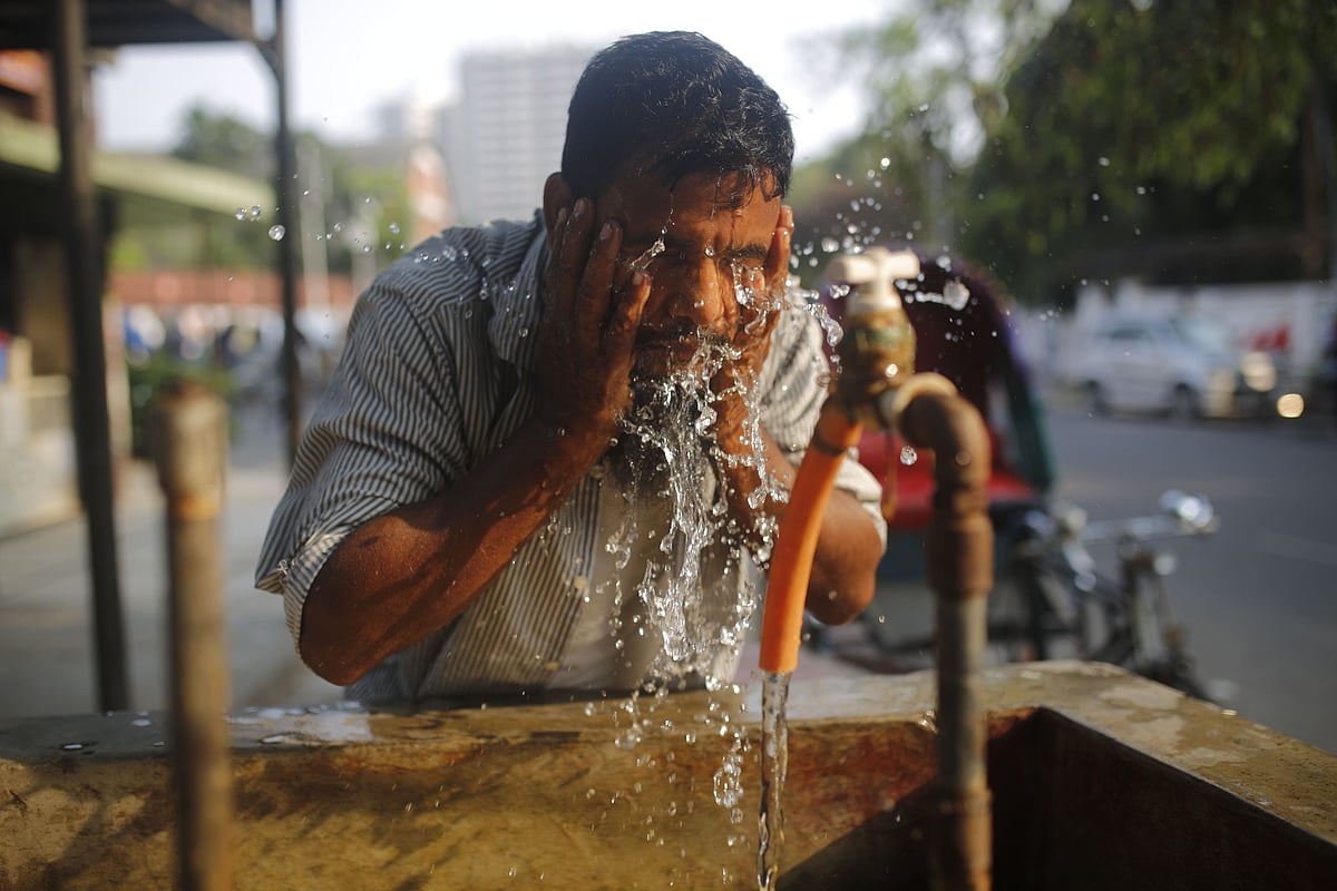 A man cools down during a heatwave